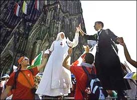 A priest and a nun dancing at World Youth Day 2005
